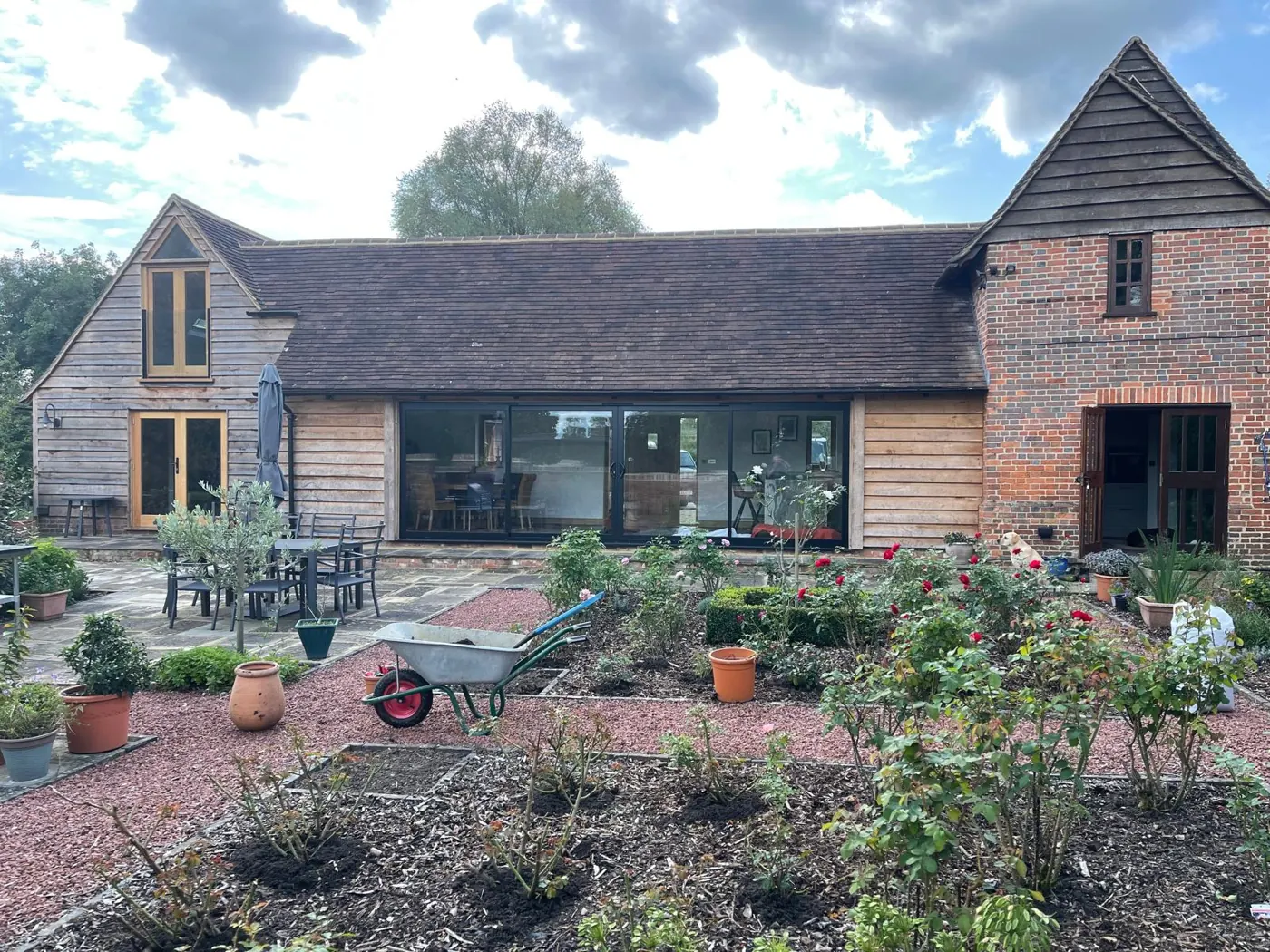 Finished oak-clad extension with a peg-tiled roof