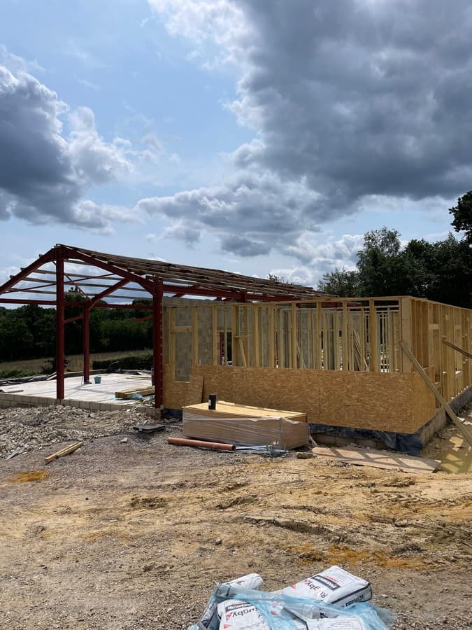 Timber stud walls inside the steel frame