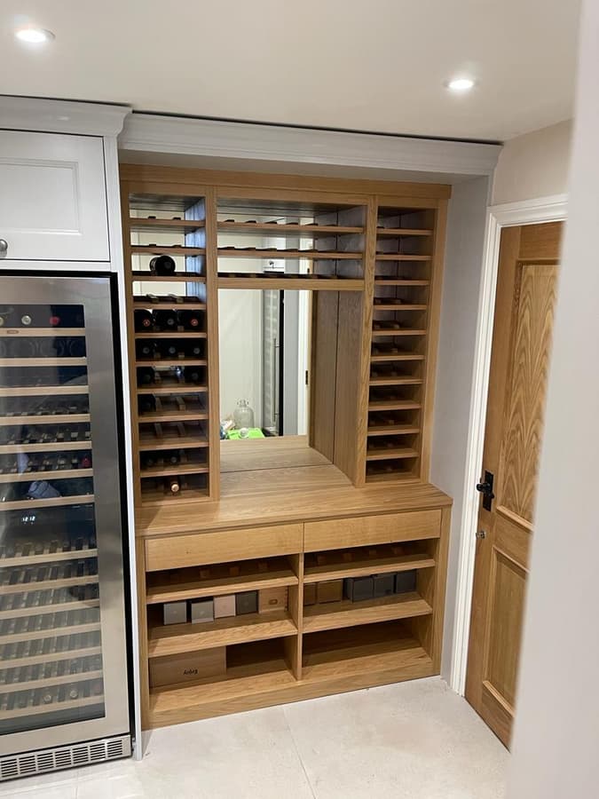 Built-in oak wine wall and cabinet