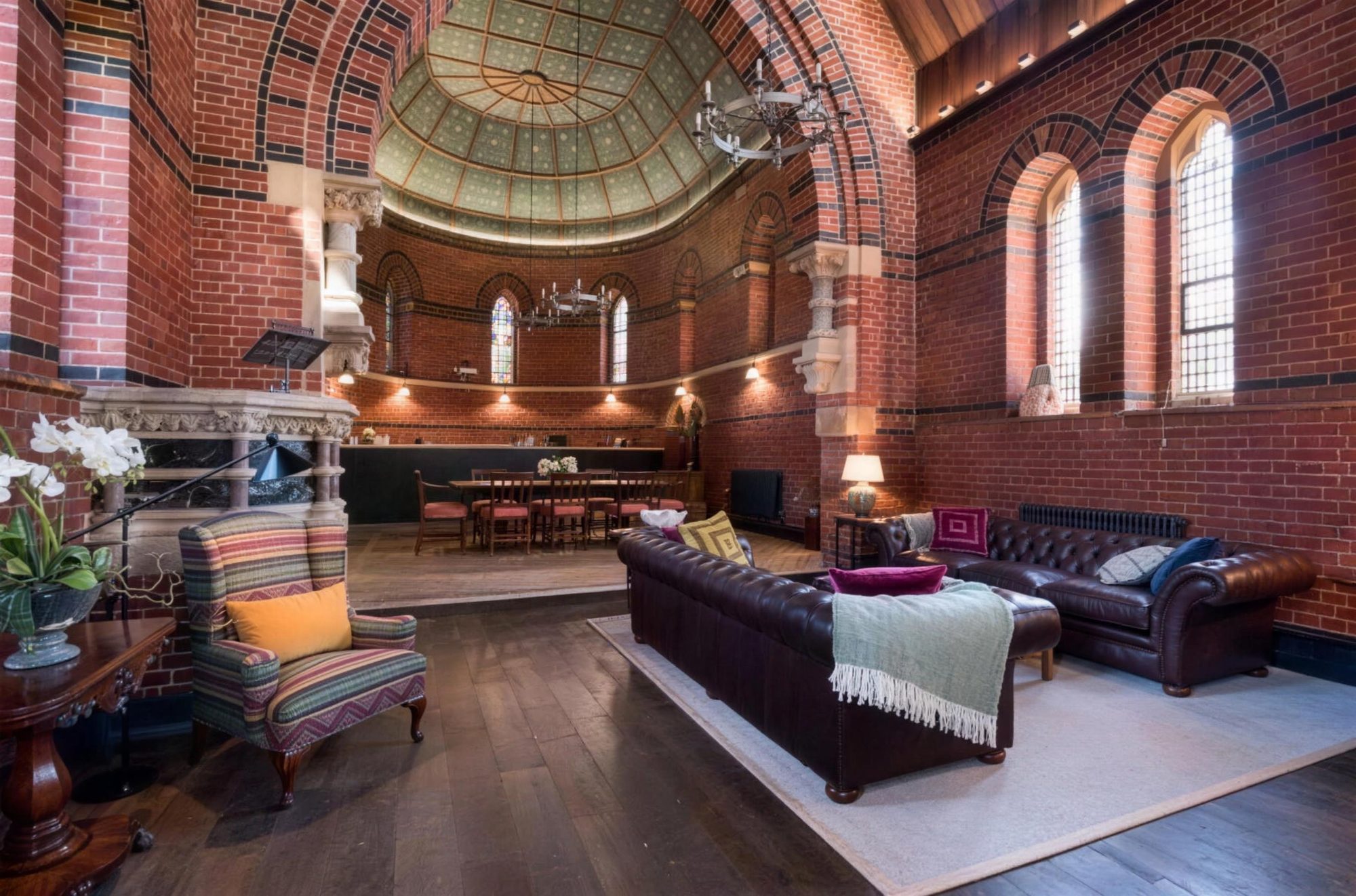 Living area with leather sofas beneath the painted dome