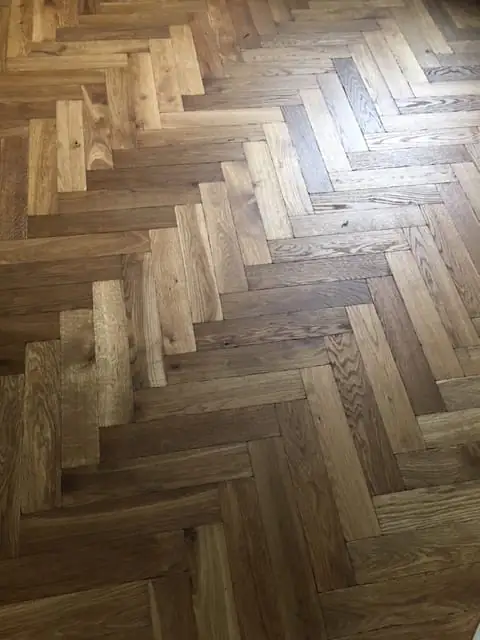Oak parquet floor laid in a herringbone pattern